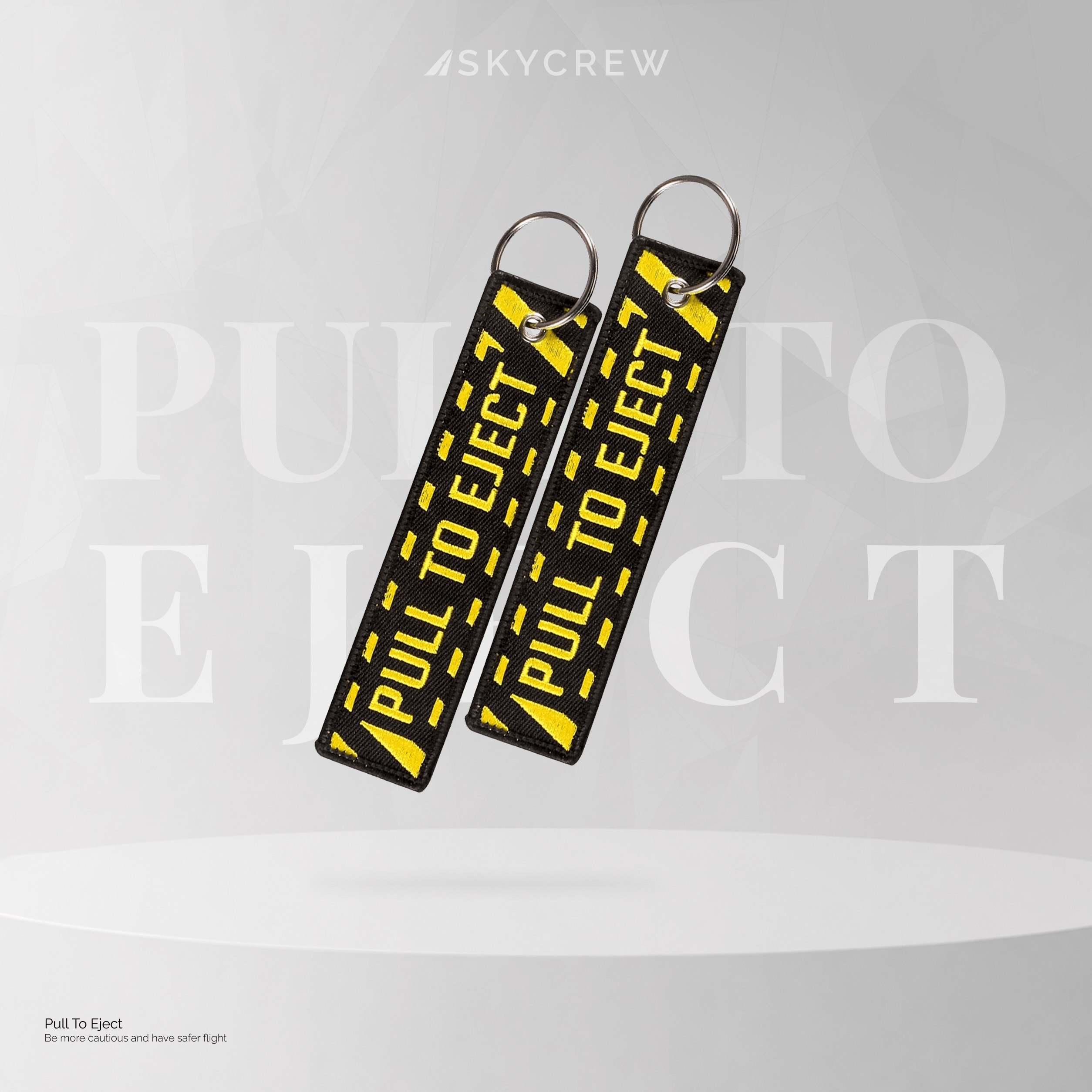 Pull-to-Eject Embroidered Keychain